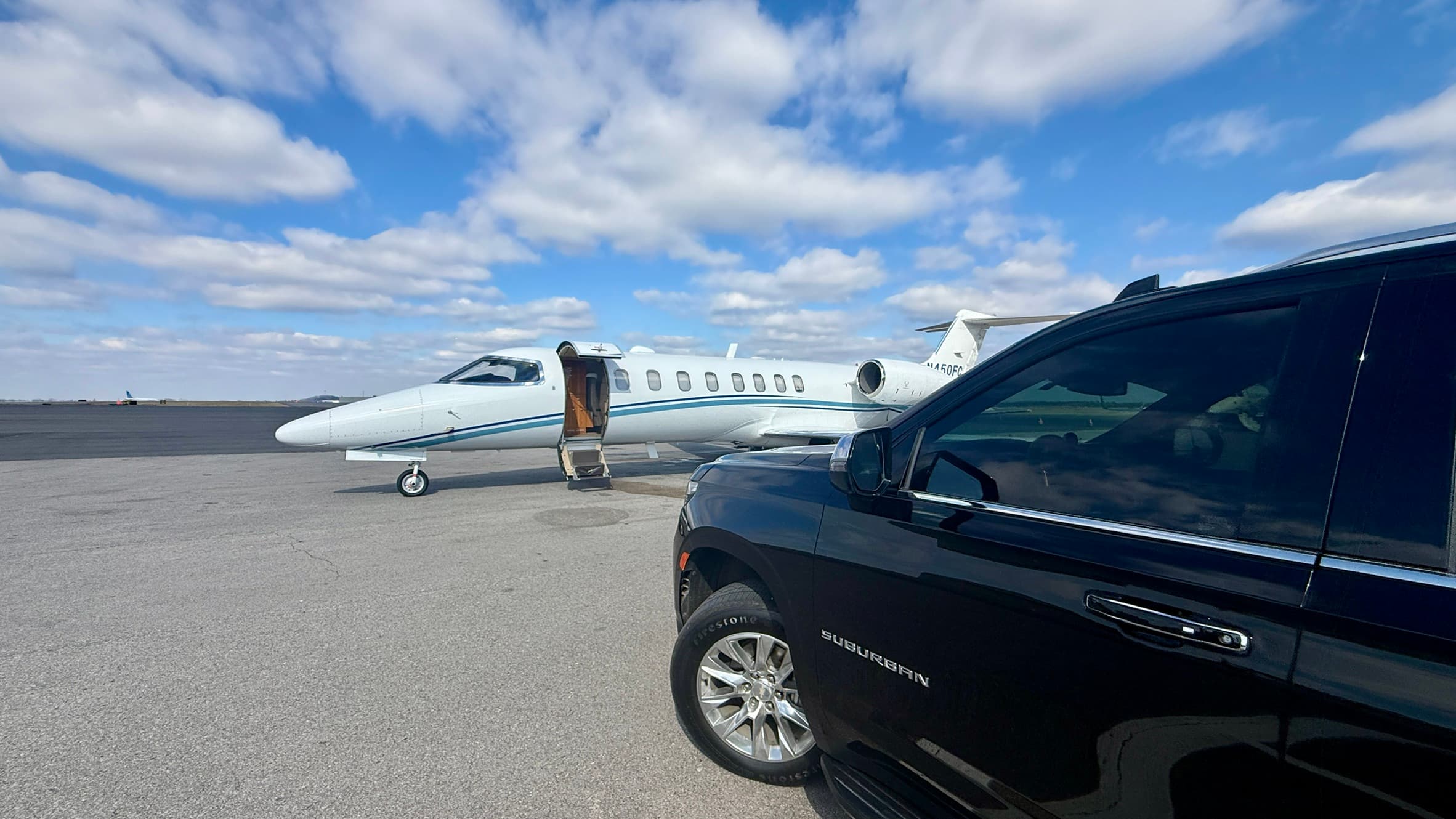 Chevrolet Suburban near airport jet